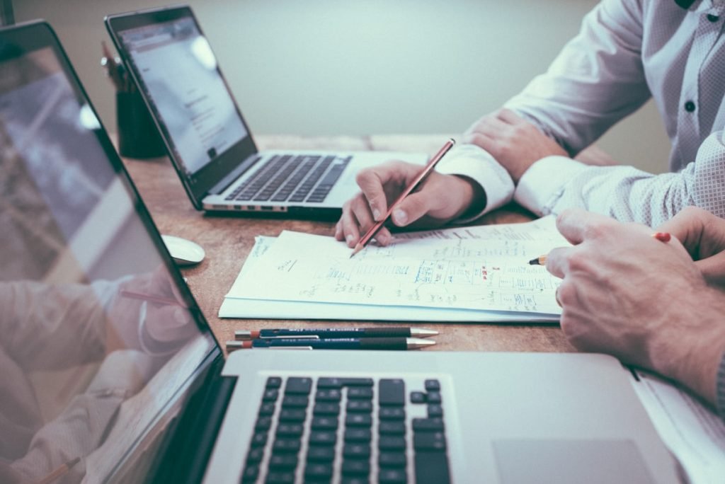 Legal professionals reviewing contract documents