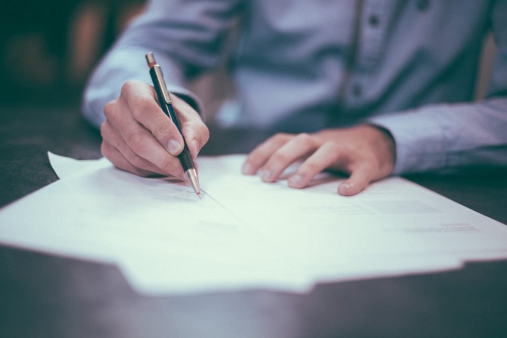 Businessman signing a legal document